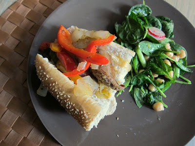 Italian Sausage with Peppers and Onions on a roll with green salad