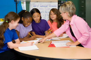 Teacher and students at a learning center.