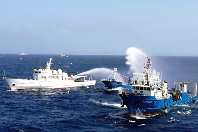 Chinese ships conduct an emergency drill in the South China Sea.