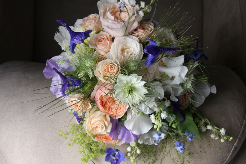 A fabulously wild looking wedding bouquet of Lily of the Valley Lilac 