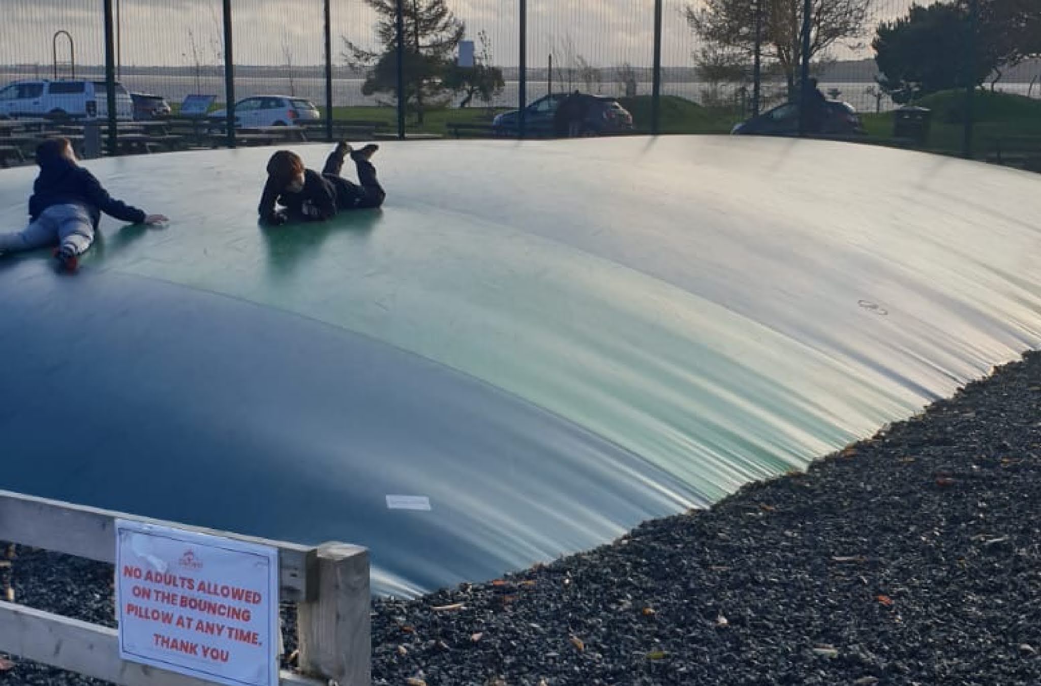 Two boys lying on a large inflatable