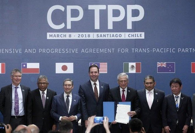 From left: New Zealand’s trade minister David Parker, Malaysian trade minister Datuk J. Jayasiri, Canadian trade minister Francois-Phillippe Champagne, Australian trade minister Steven Ciobo, Chilean foreign minister Heraldo Munoz, acting Brunei foreign affairs minister Erywan Dato Pehin and Japanese minister of economic revitalization Toshimitsu Motegi after signing the 11-nation Comprehensive and Progressive Agreement for Trans-Pacific Partnership in Santiago