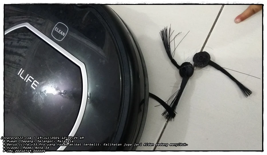 Pictures of the iLife v55 Pro vacuum cleaner robot side brush that has been damaged is often due to being tangled with thread or rope. Aidan's fingers were also busy.