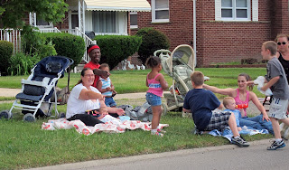 typical family watching the memorial day parade