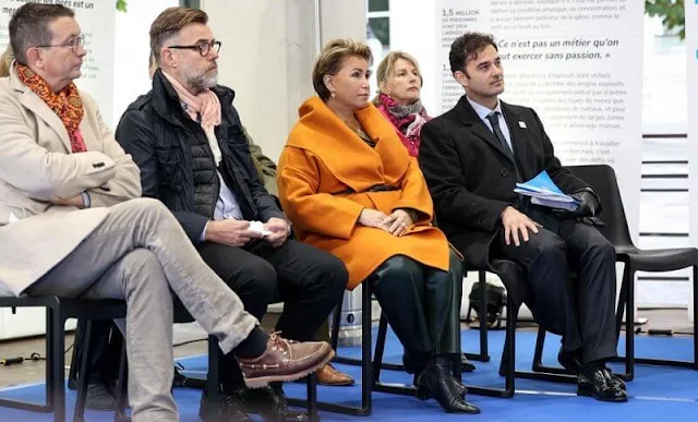 Grand Duchess Maria Teresa wore a Hooded orange cashmere coat by Dusan. Short open cashmere coat with hood