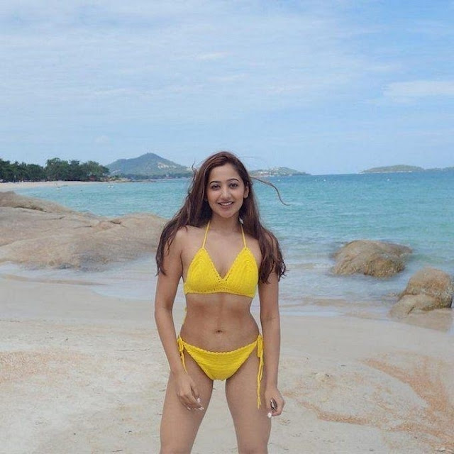 Twinkle Govindani, Bollywood actress, yellow bikini, beach beauty, Twinkle Govindani bikini stills, sun-kissed charm.