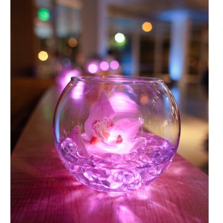 Lighting in fish bowl for wedding decoration, flowers are topped on aqua crystal beads