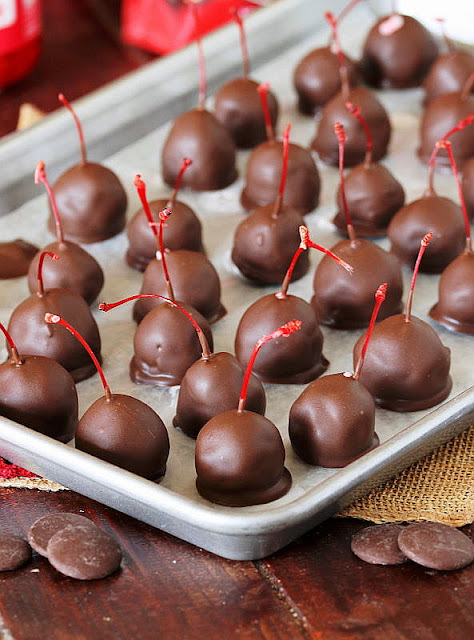 Baking Sheet of Homemade Chocolate Covered Cherries Image