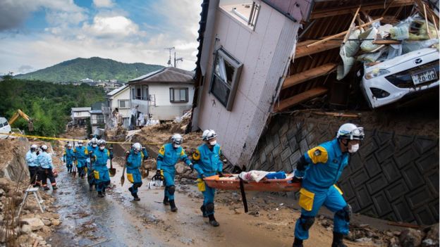 Japan floods: At least 100 dead in record rainfall