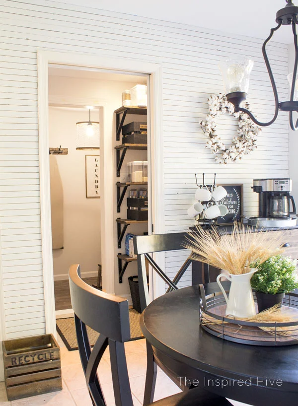 Farmhouse style kitchen, pantry, and laundry room. Black and wood tones are perfect for modern farmhouse decor.