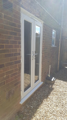 The New French Doors leading to the soon to be side Patio from the Den