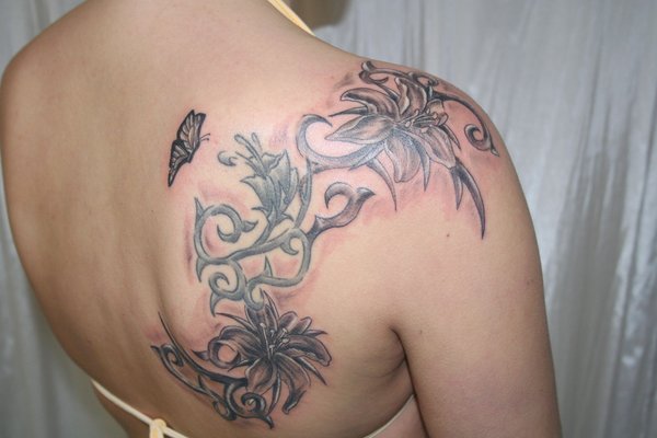 arm tattoos - lotus blossom tattoo. arm butterfly tiger. arm tattoos