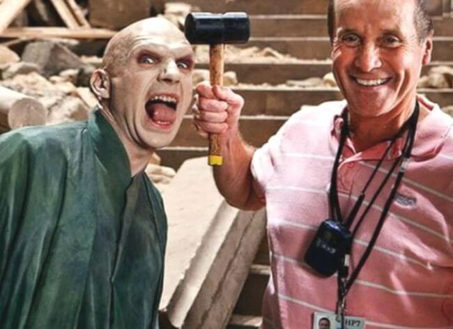 60 Iconic Behind-The-Scenes Pictures Of Actors That Underline The Difference Between Movies And Reality - Voldemort gets hammered on the set.