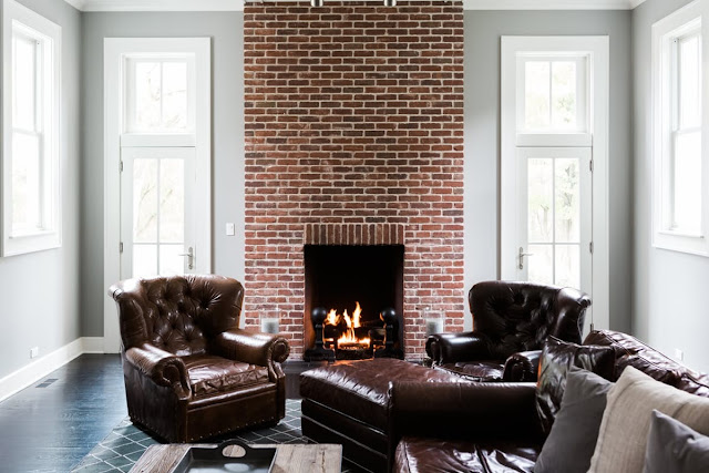 Modern farmhouse great room with red exposed brick fireplace on Hello Lovely Studio