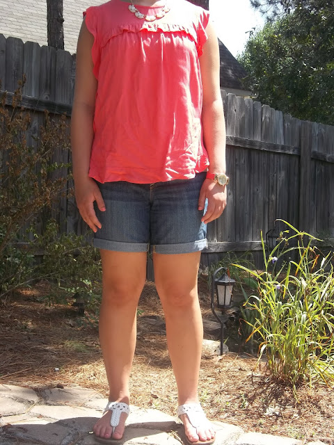 coral blouse, jean shorts, statement necklace, white sandals, watch. outfit