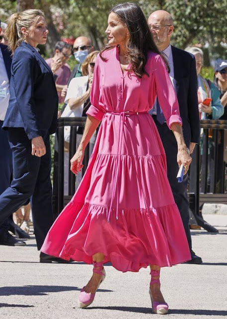 Queen Letizia wore a fuchsia silk georgette maxi dress by Hugo Boss, and fuchsia espadrilles by Castaner