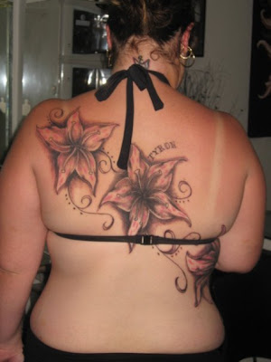 lower back tattoos for females. tribal tattoo back pieces rose and dagger