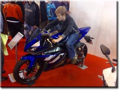 Kid on Yamaha YZFR125 Another law which makes 125 cc motorcycles popular