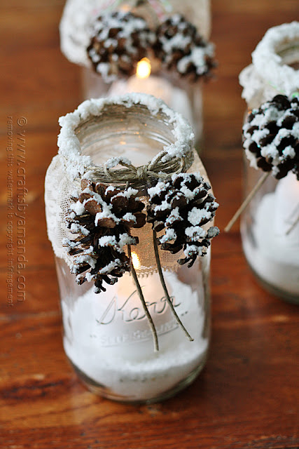 http://craftsbyamanda.com/2013/12/snowy-pinecone-candle-jars.html