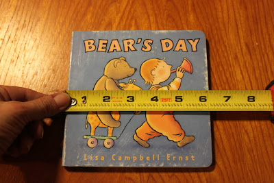 Board book remake in Photoshop: Room 626 Photoshop teacher Linda Miller measuring width of book