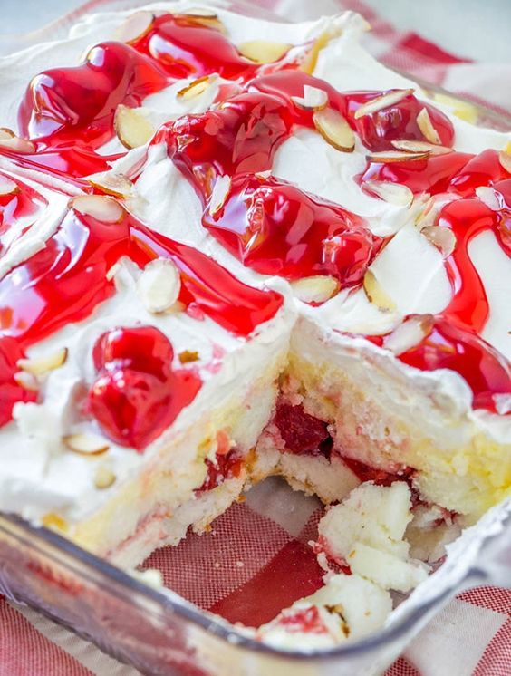 Heaven on Earth Cake with delicious layers of angel cake, sour cream pudding, cherry pie filling, whipped topping, and almonds. Creamy and decadent, this cherry trifle is a sure crowd pleaser!