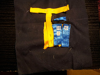 Early stage of letter T - Letter T in yellow is pinned on and the Tardis and contents are starting to be attached.