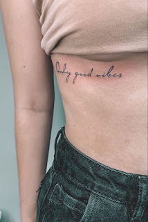 19 Minimalist Script Tattoo Quotes Along The Ribs