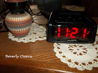 alarm clock on a night stand