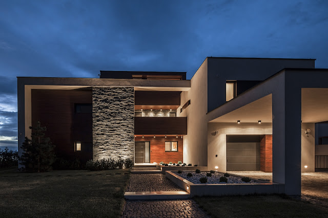 Front facade of Lake Side Duplex House at night 
