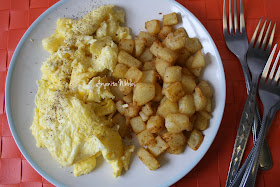 A plate of eggs and breakfast potatoes made in the Actifry from www.anyonita-nibbles.com