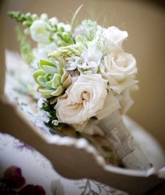 The bridesmaid bouquet version with the green cactus white roses and