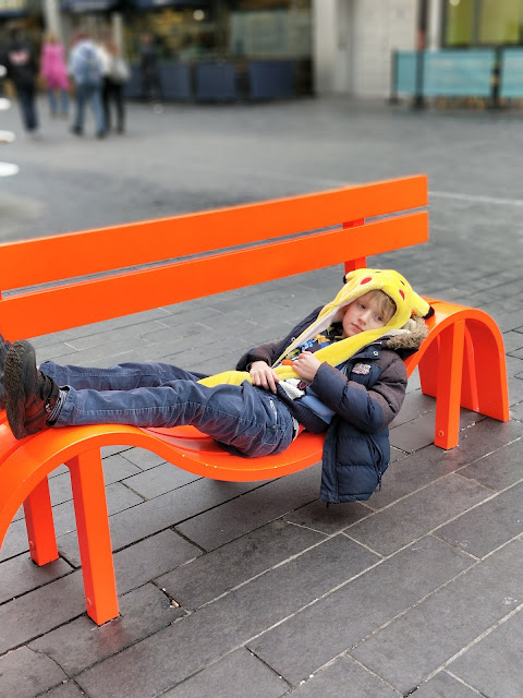 child with ASD on quirky bench in London