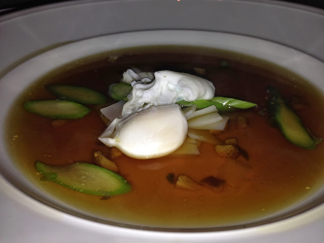 Double Duck Consomme, Poached Quail Egg, Rice Noodles, Asparagus Tips, White Truffle Oil