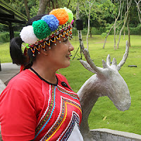 Tsou tribal woman with deer carving