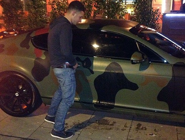 No wonder he's leaving! Man City striker Mario Balotelli agrees £20m deal with AC Milan hours after Man United lout takes leak on his £160,000 camouflaged Bentley