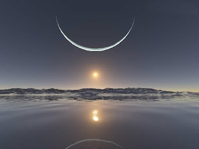 Photo of crescent moon over water