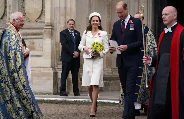 Kate Middleton wore an ivory coat dress by Alexander McQueen. Jenny Packham Roxy clutch. Jane Taylor Calypso halo headband