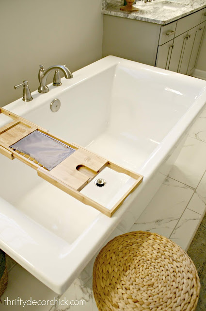 Deep soaking tub with wood caddy