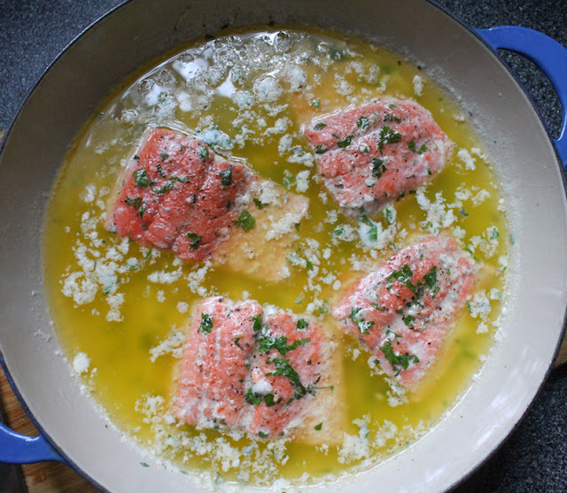 Food Lust People Lust: Herb butter poached wild salmon is tender and flavorful. The herbs complement the delicate flavor of the fish, and the simmering butter ensures that it won’t overcook or dry out. Do not worry about all the “leftover” butter. It can be used to flavor vegetables, in another seafood dish or chill it and pop it in an airtight bag in the freezer to keep for the next time you poach fish.