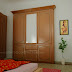 Kerala bedroom interior with wooden wardrobe