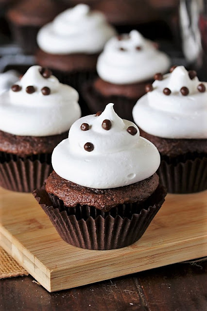 Chocolate Cupcake Topped with Marshmallow Frosting and Chocolate Pearls Image