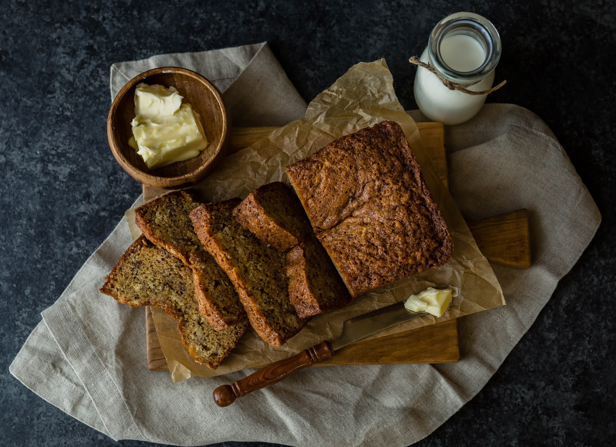 sliced loaf with butter and milk