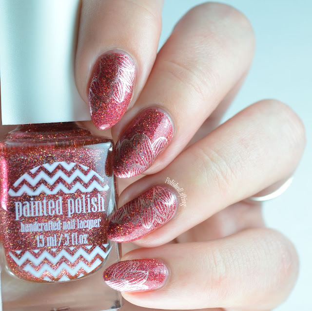 Holographic red nail polish with gold flowers