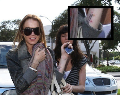 Lindsay Lohan revealed her Shhh tattoo while of tattoo design: Lindsay Lohan 