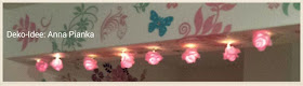 Lichterkette mit Rosen an der Decke