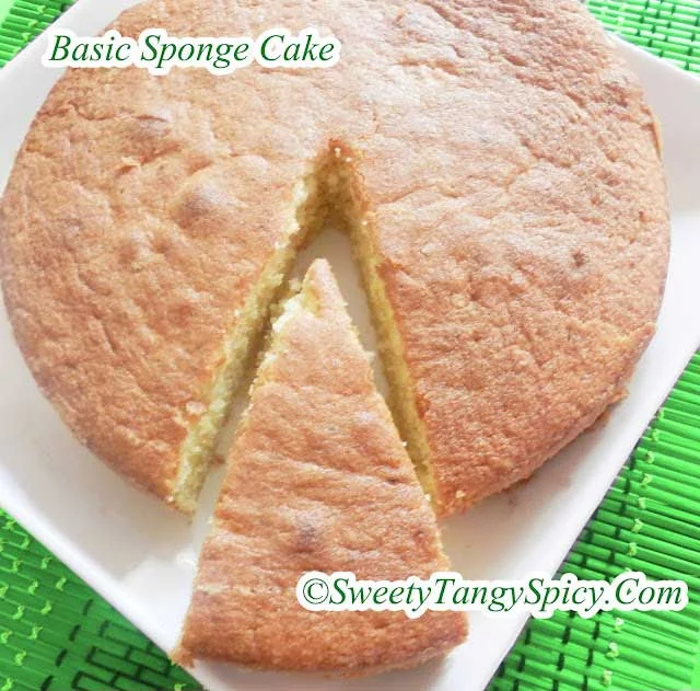 A round sponge cake with a slice removed, showcasing its light and airy texture.