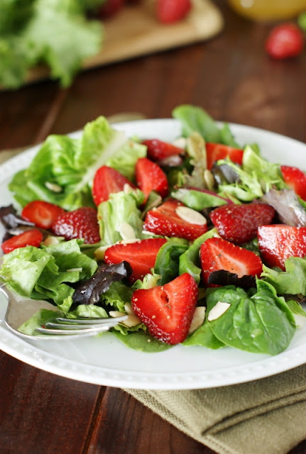 looking fresh strawberries are starting to brand their appearance inwards grocery stores hither Strawberry & Greens Salad amongst Honey Vinaigrette