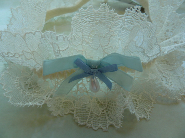 So here is the garter with the smaller blue bow that came with it and sewn 