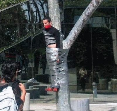 crazy man tied to tree