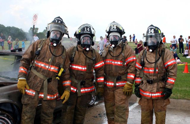 Actual firefighters in full firefighting gear. How about this?